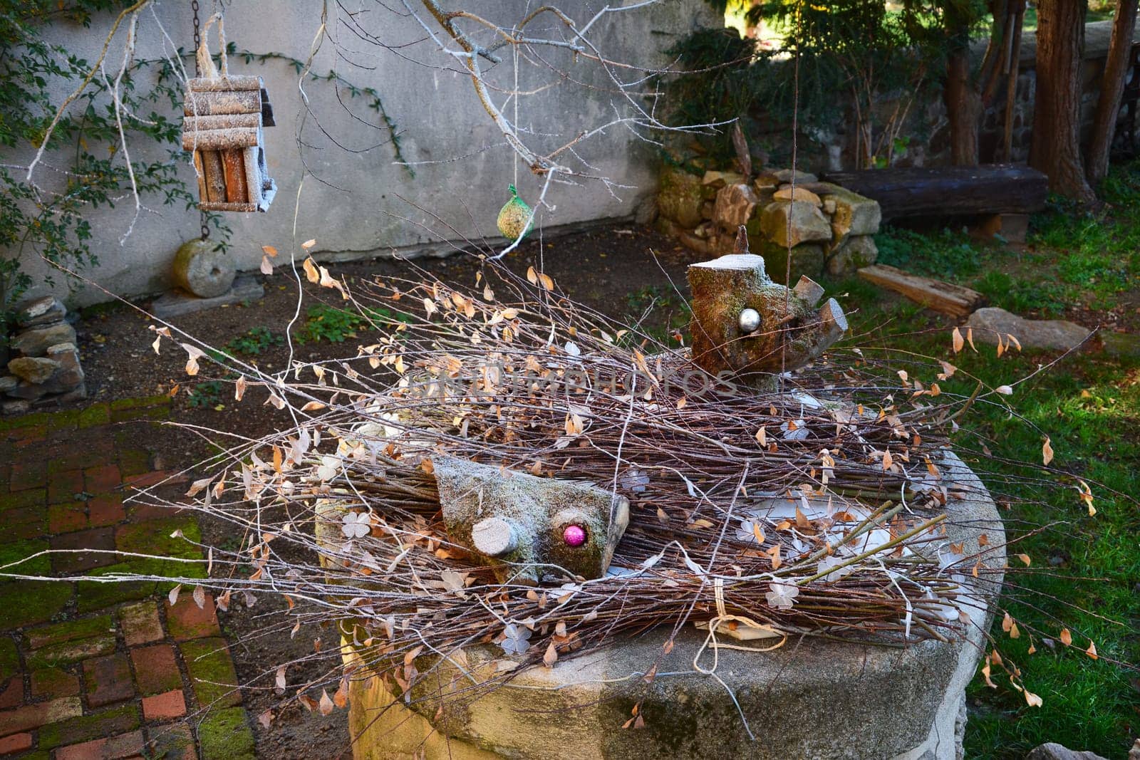 dried branches and leaves as decorations in the garden by Godi