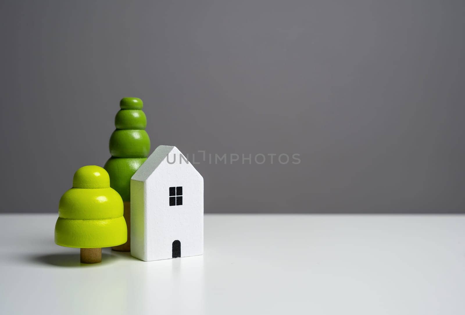 House with trees. Affordable housing. Buying a nice house. Garden work, landscape design. Figurine. Mortgage and loan. by iLixe48