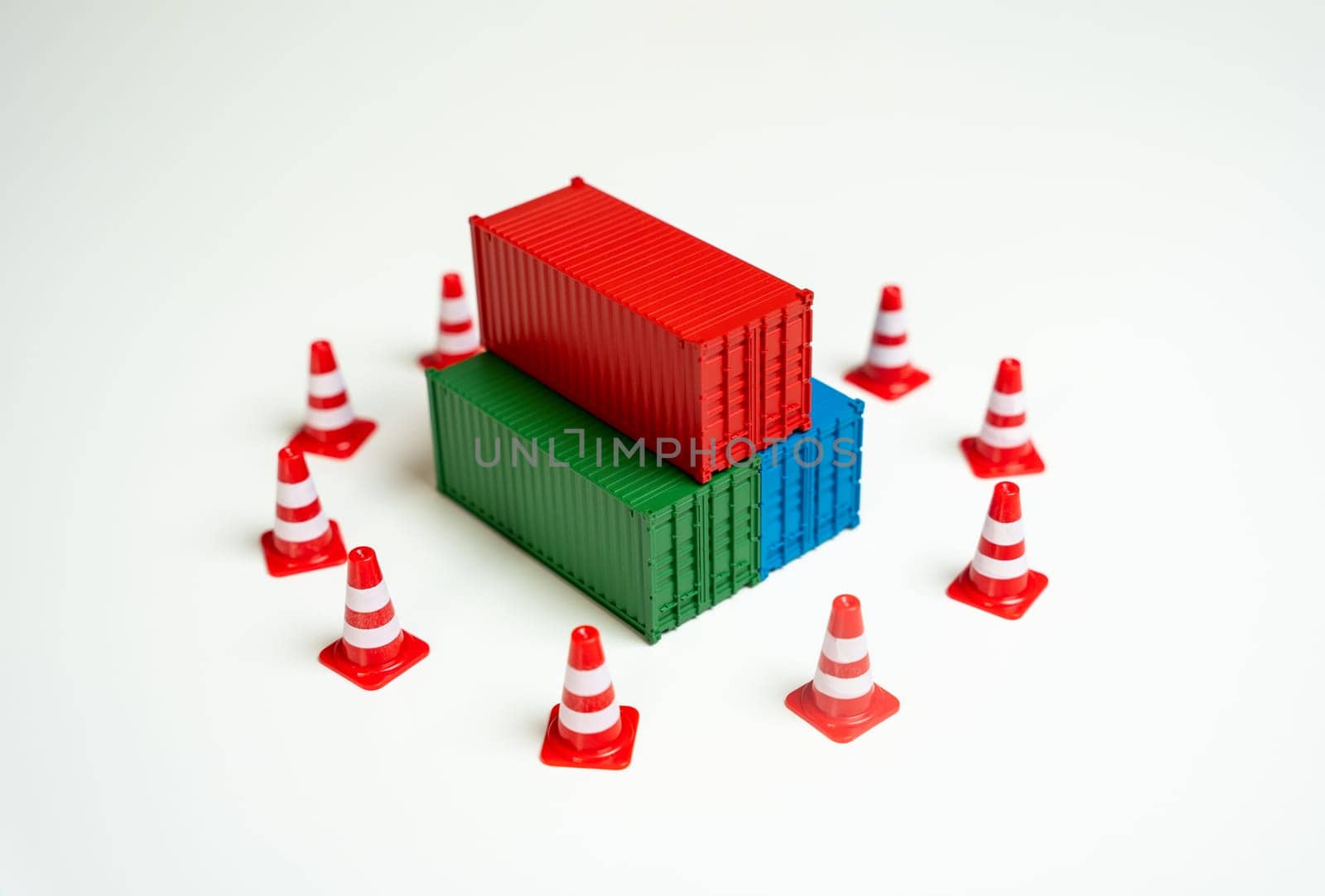 Seizure of cargo. Sea containers are surrounded by road cones and are inaccessible for transportation. Legal or logistical challenges hindering the movement of goods. Shipping complexities disruptions