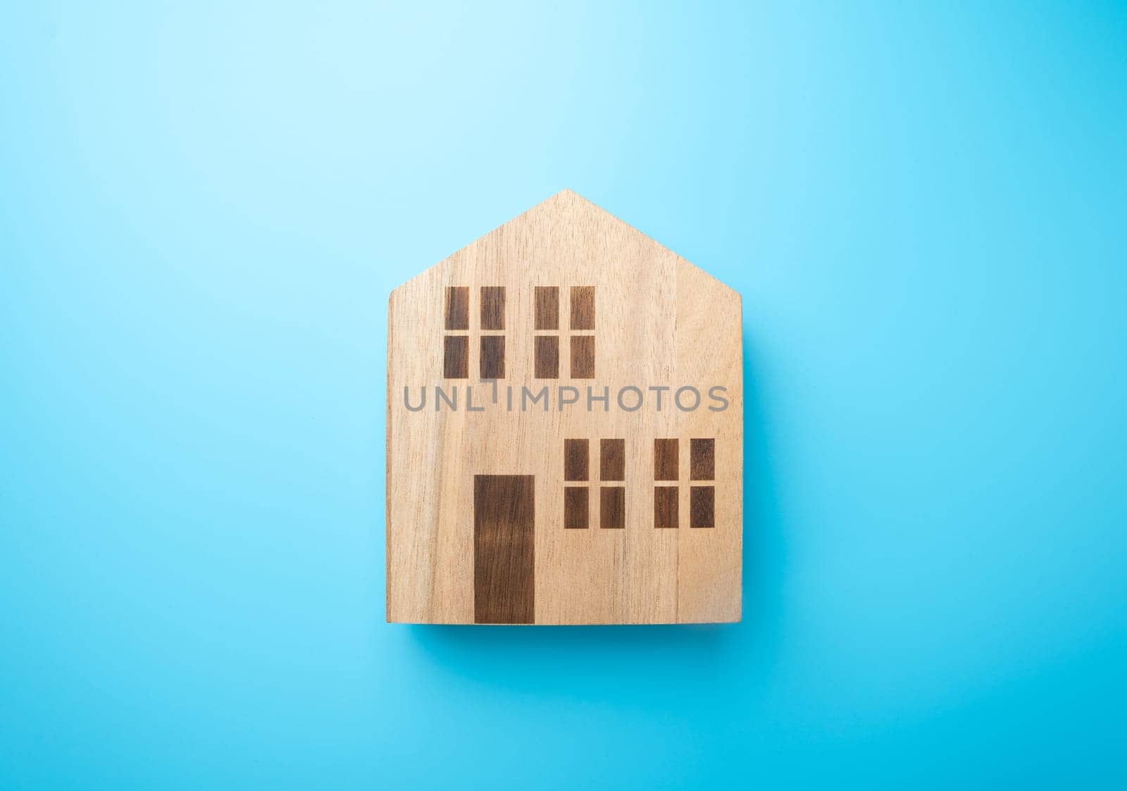Wooden figures of houses. Buying and selling. Housing options. Affordable housing. Mortgage. Realtor services.