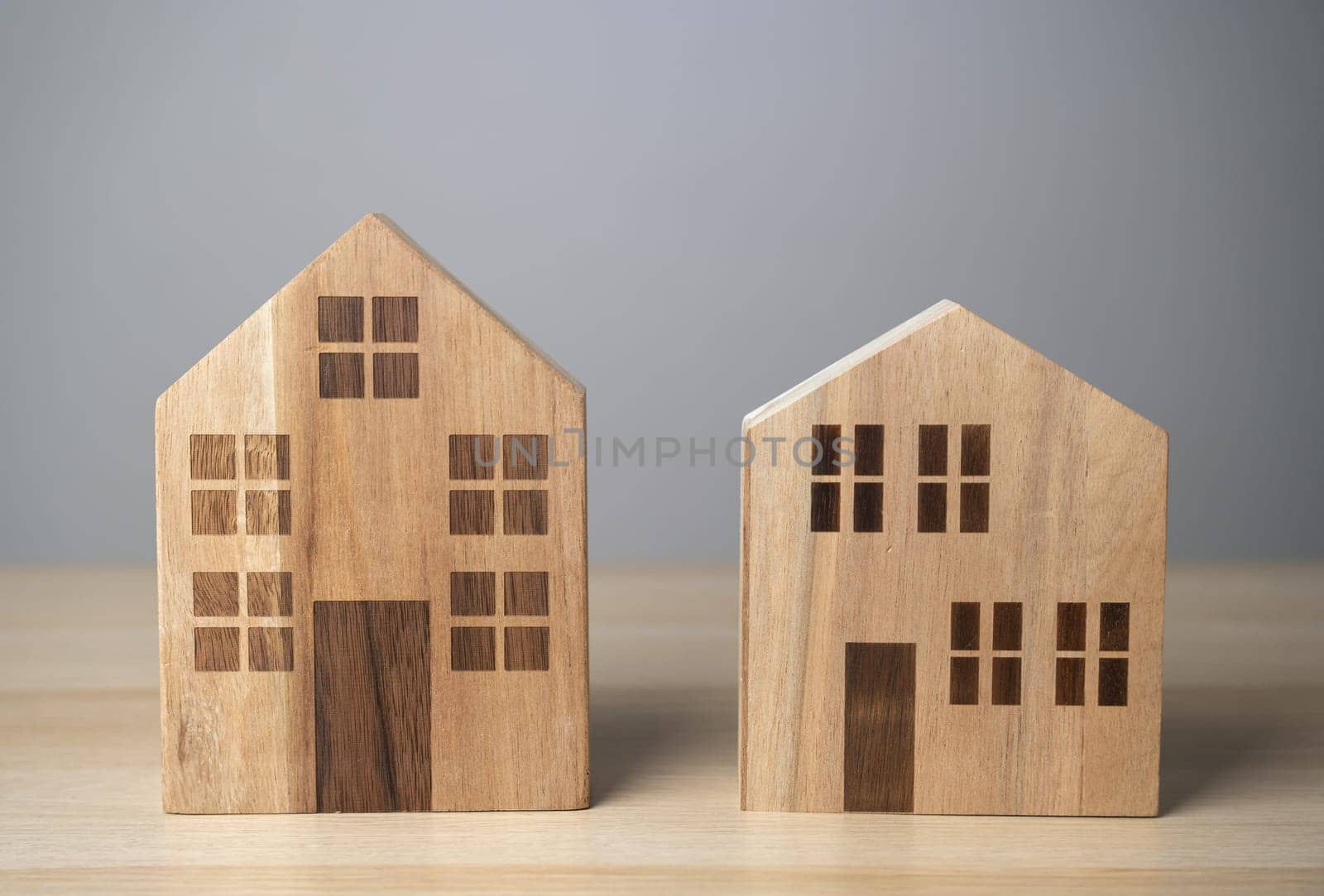 Two houses. Wooden figures. Buying and selling. Housing options. Buildings and infrastructure. by iLixe48