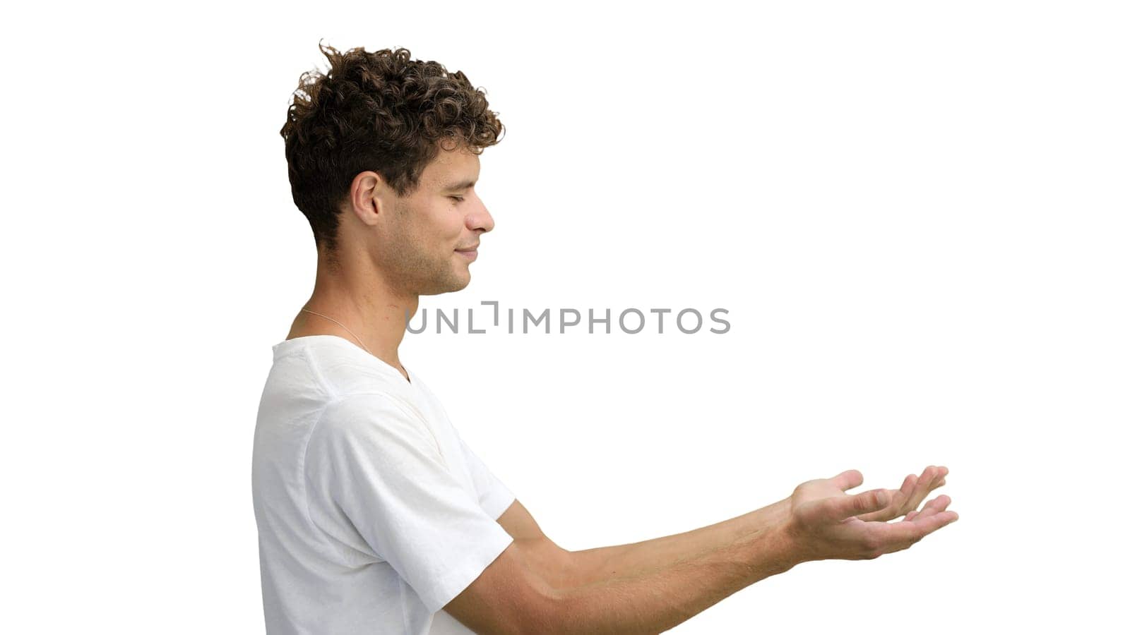 A man in a white T-shirt, on a white background, close-up, pointing to the side by Prosto