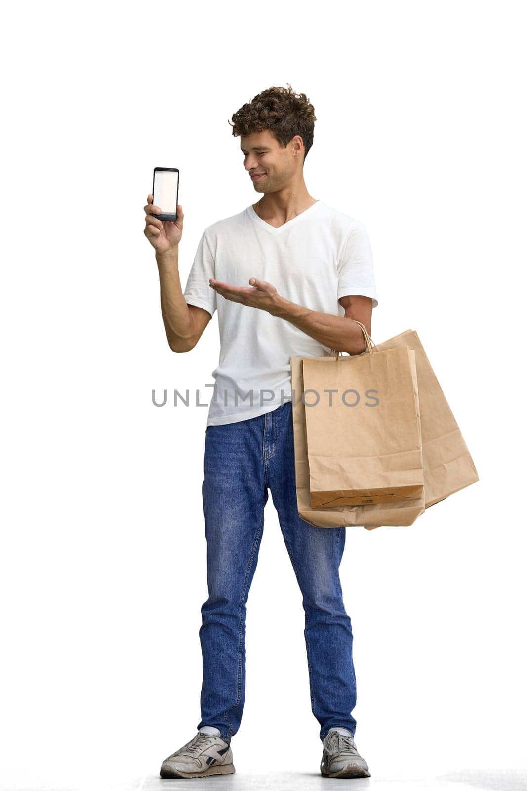 A man in a white T-shirt, on a white background, full-length, with bags and a phone by Prosto