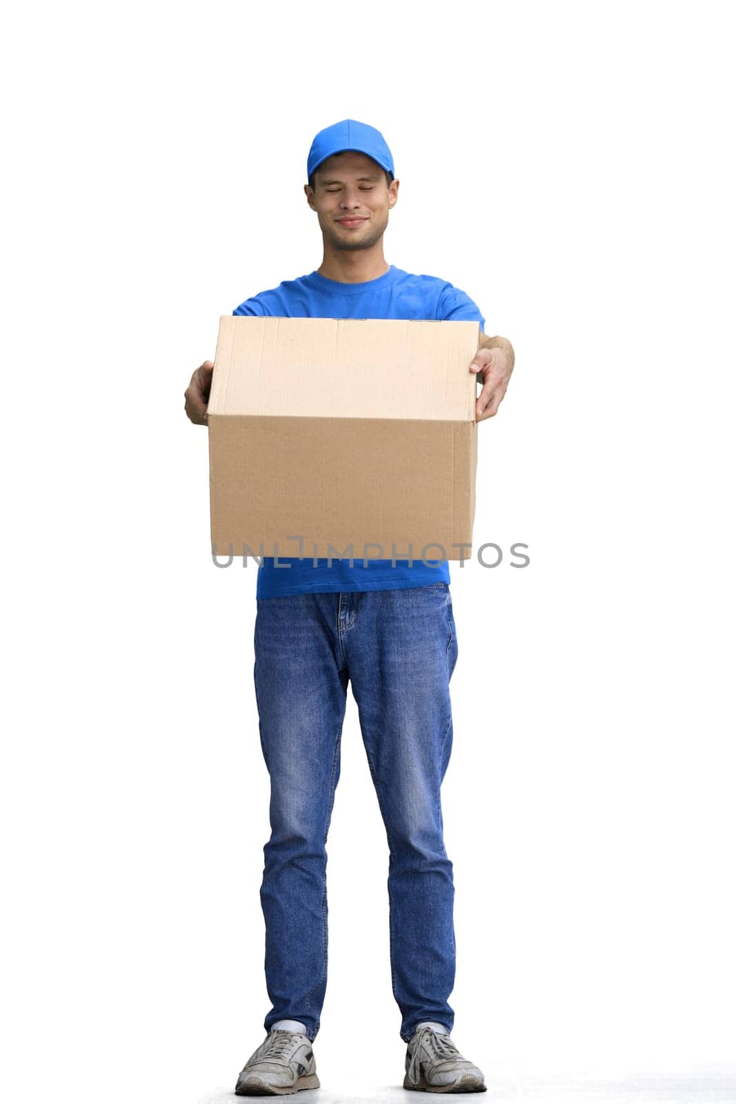 A male deliveryman, on a white background, full-length, with a box.