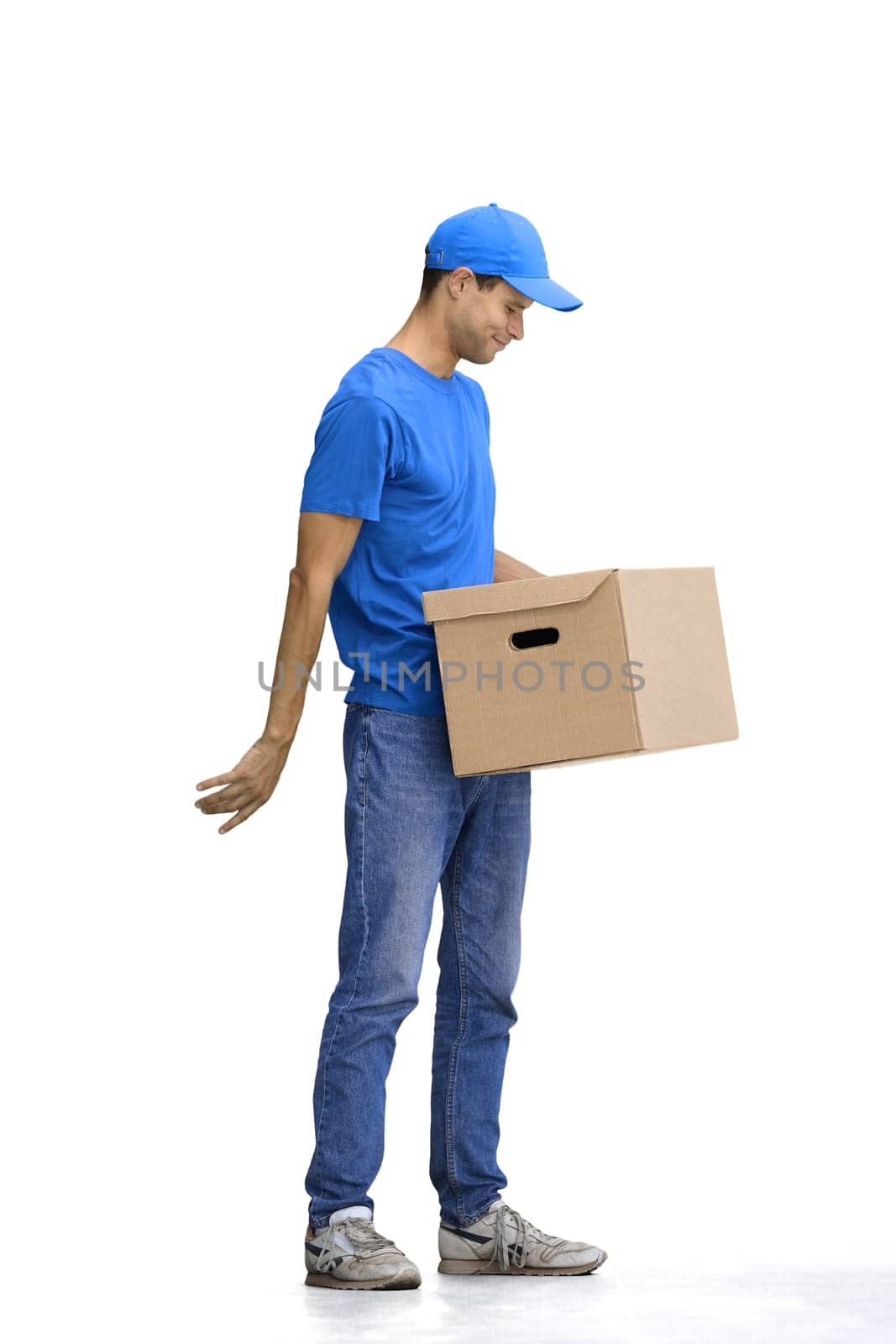 A male deliveryman, on a white background, full-length, with a box.