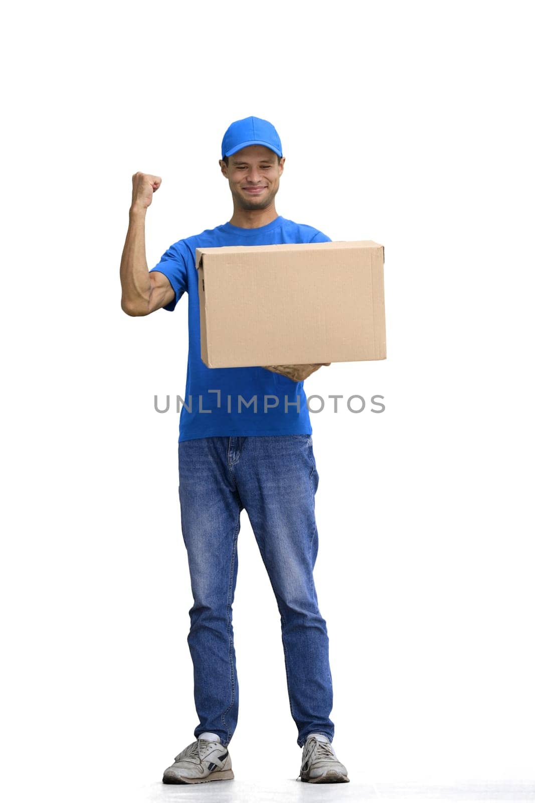 A male deliveryman, on a white background, full-length, with a box.
