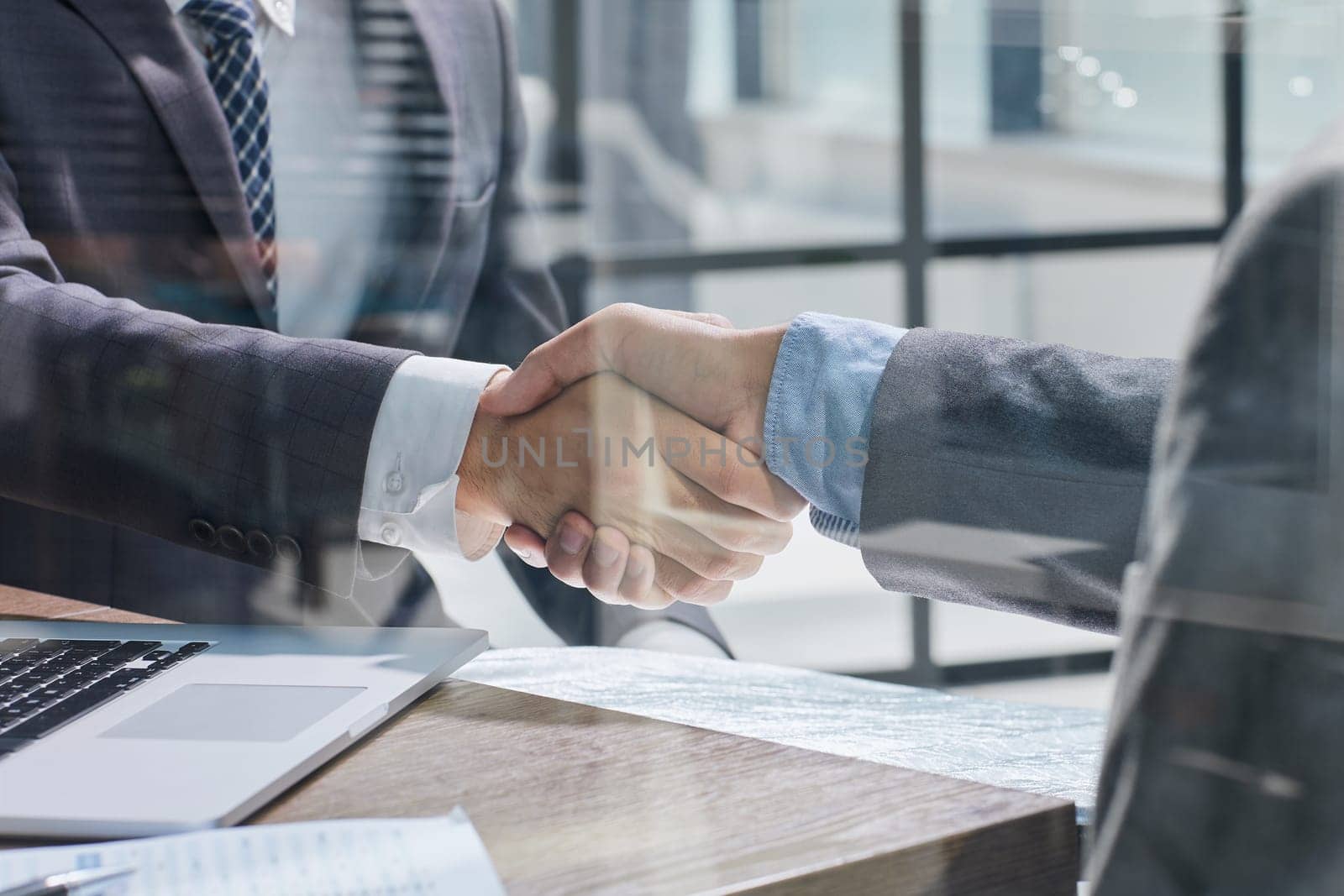 Businessman handshake for teamwork of business merger and acquisition by Prosto