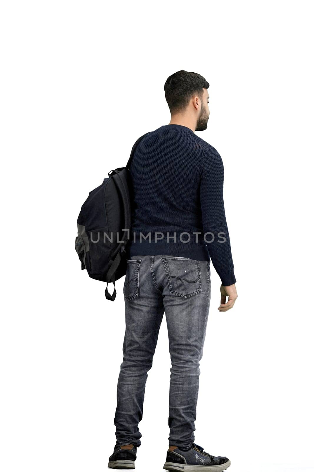 A man, full-length, on a white background, with a backpack.