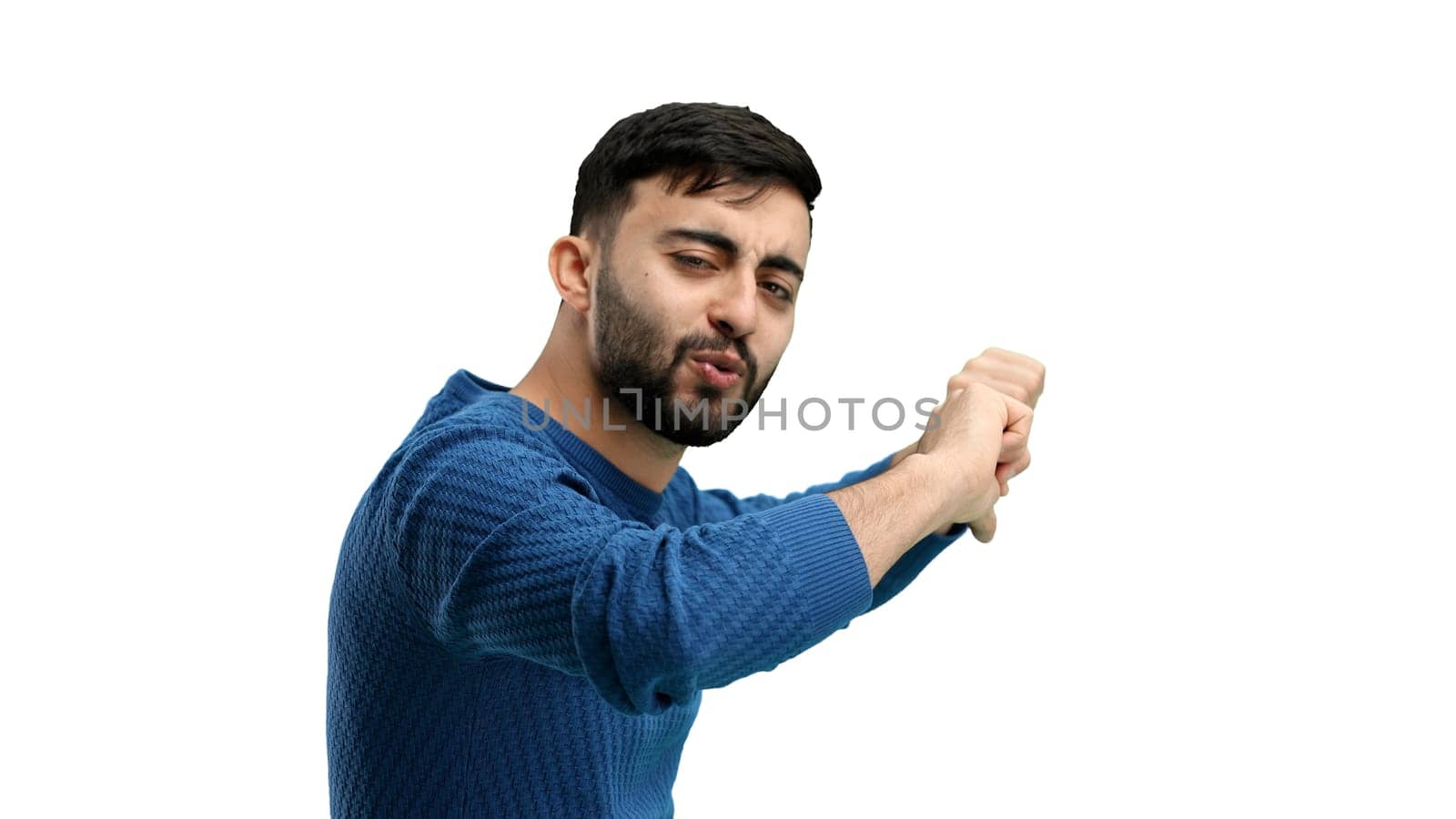 A man, close-up, on a white background, shows his thumbs down.