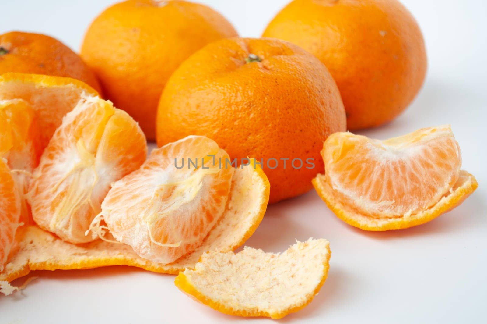 Mandarin oranges on white cover background.
