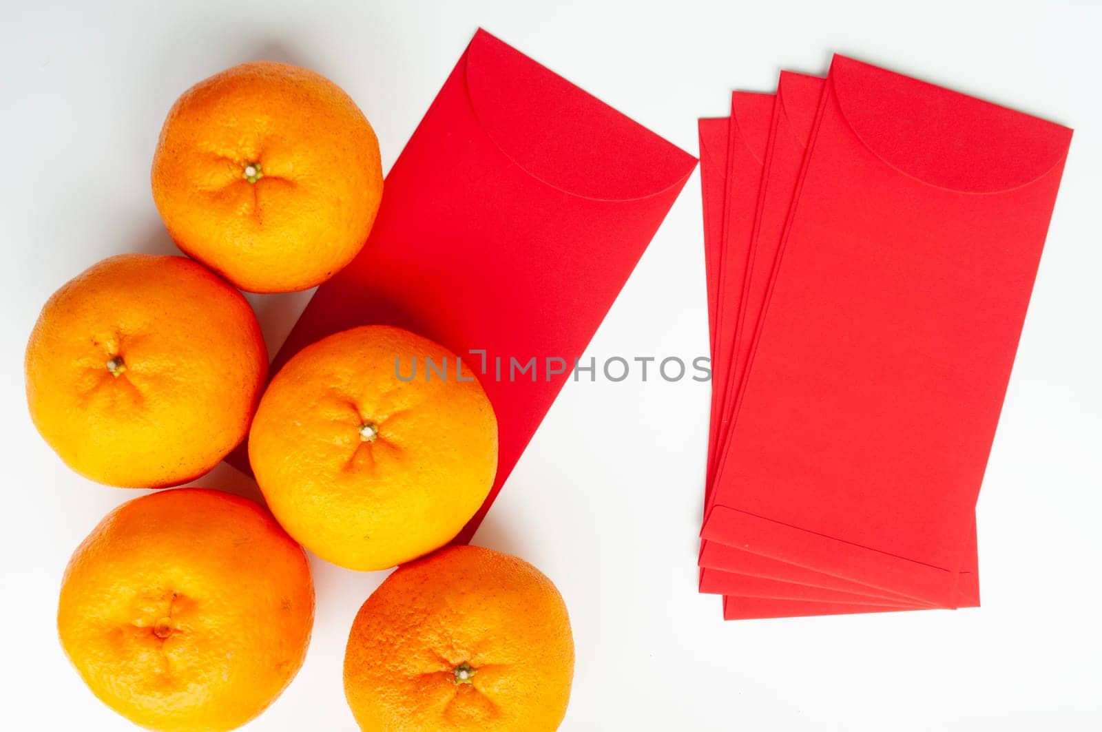 Top view of Mandarin oranges and Chinese New Year red envelope. Chinese New Year celebration concept.