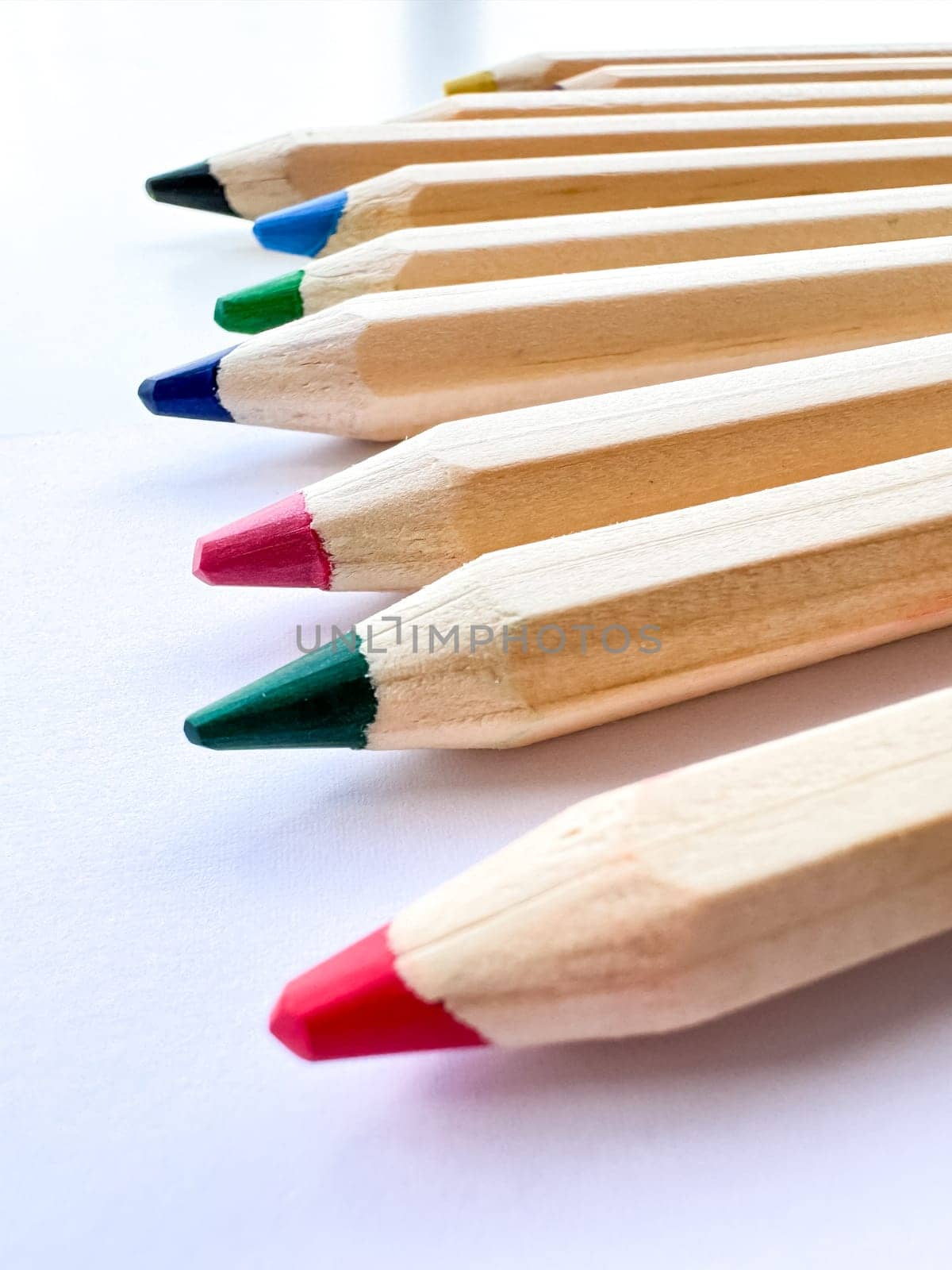 Wooden colorful ordinary pencils isolated on a white background by Lunnica