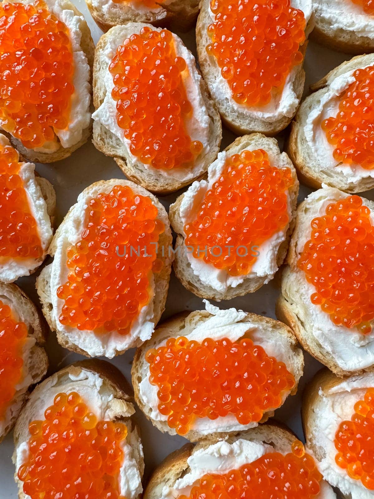 Baguette sandwiches with red salmon caviar and cheese. Top view. by Lunnica
