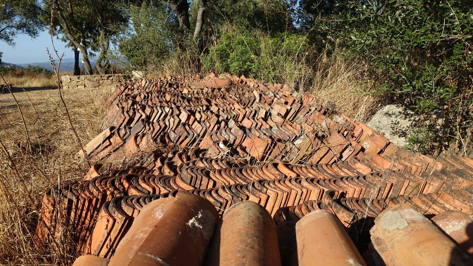 Hundreds of antique roof tiles ready to be used for a new home. by Jamaladeen