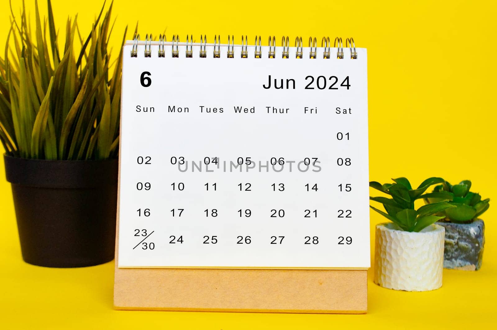 June 2024 calendar with yellow over background. Monthly calendar concept.