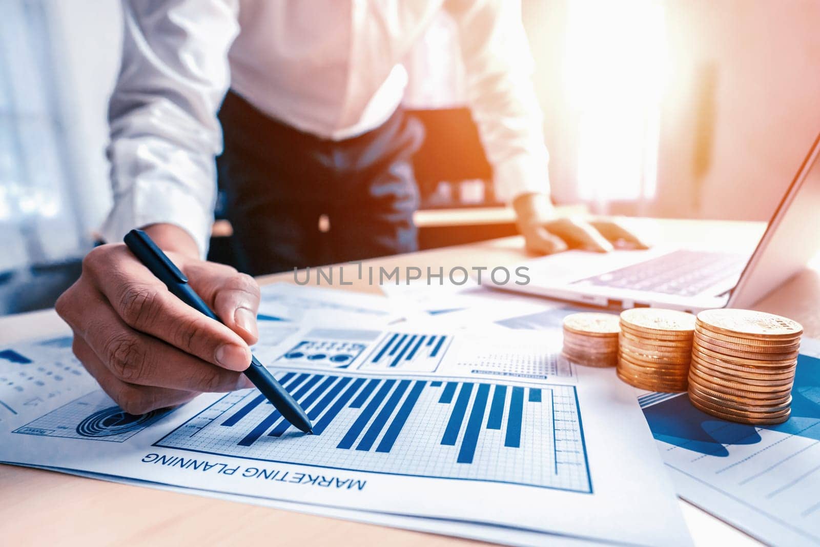 Businessman accountant or financial expert analyze business report graph and finance chart at corporate office. Concept of finance economy, banking business and stock market research. uds