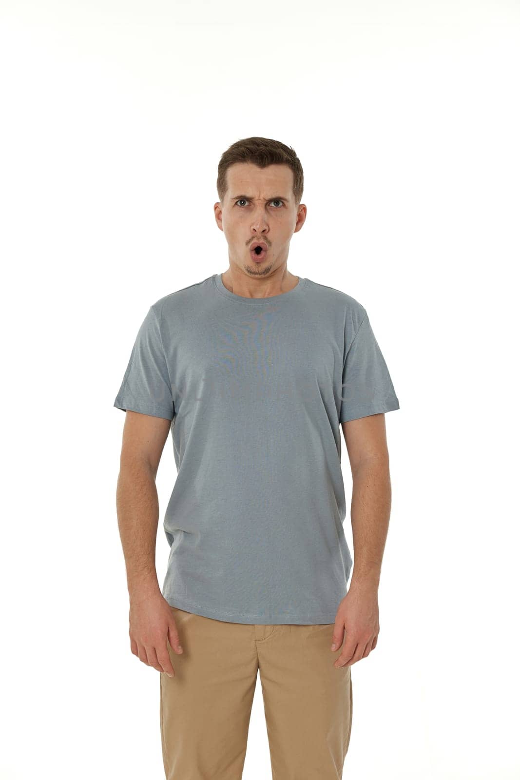 surprised guy looking at camera on white studio background