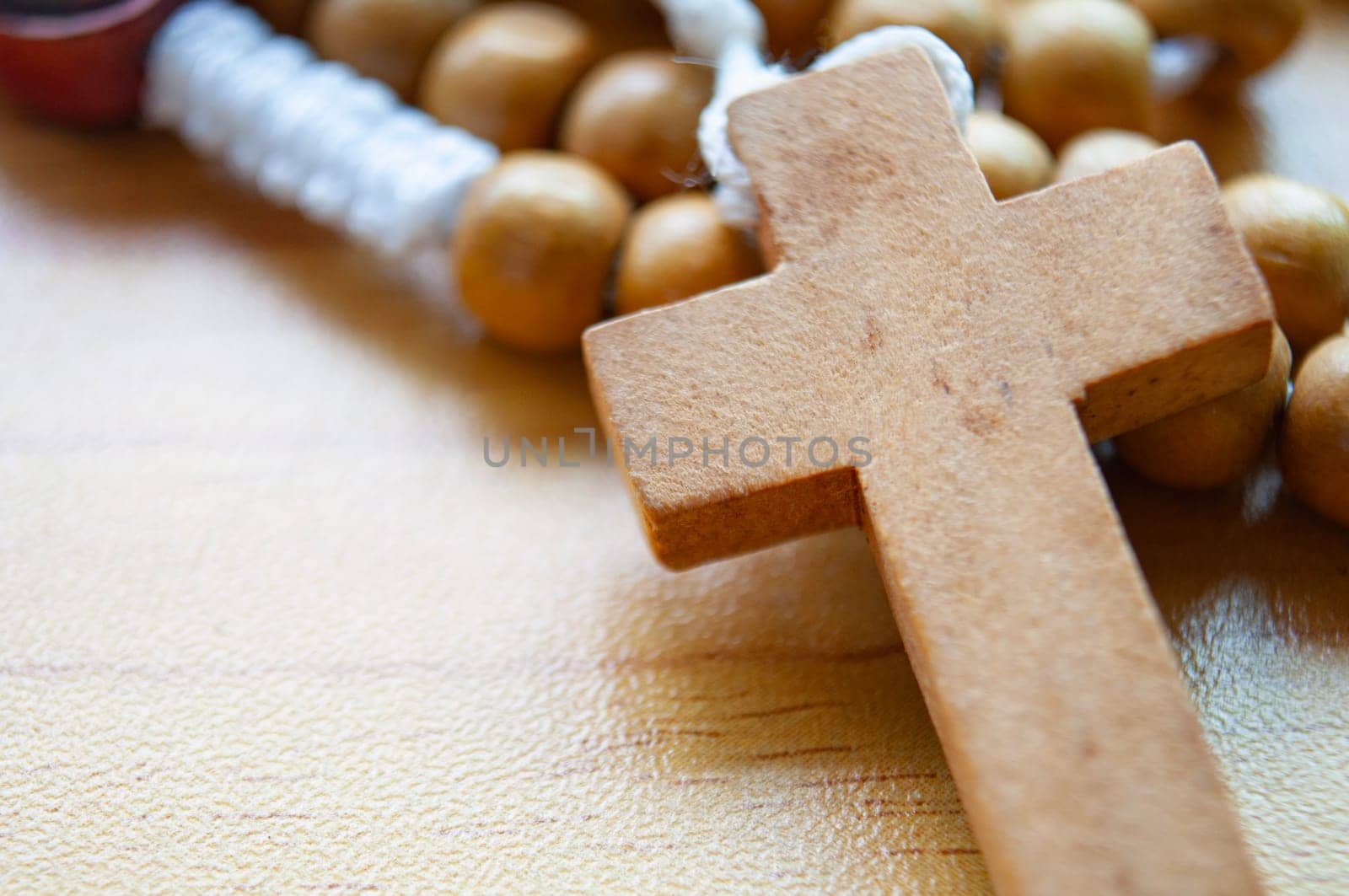 Close up view of Holy Rosary with customizable space for text. Christianity concept.