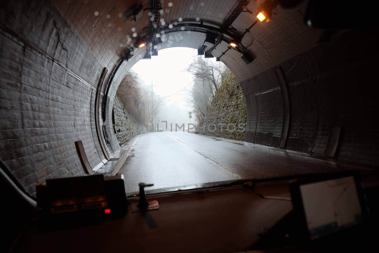 Underground tunnel with cars in the evening. Blurred background.