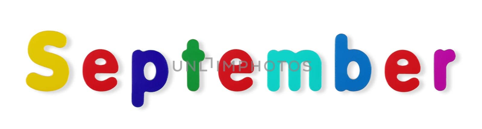 A September word in coloured magnetic letters on white with clipping path to remove shadow