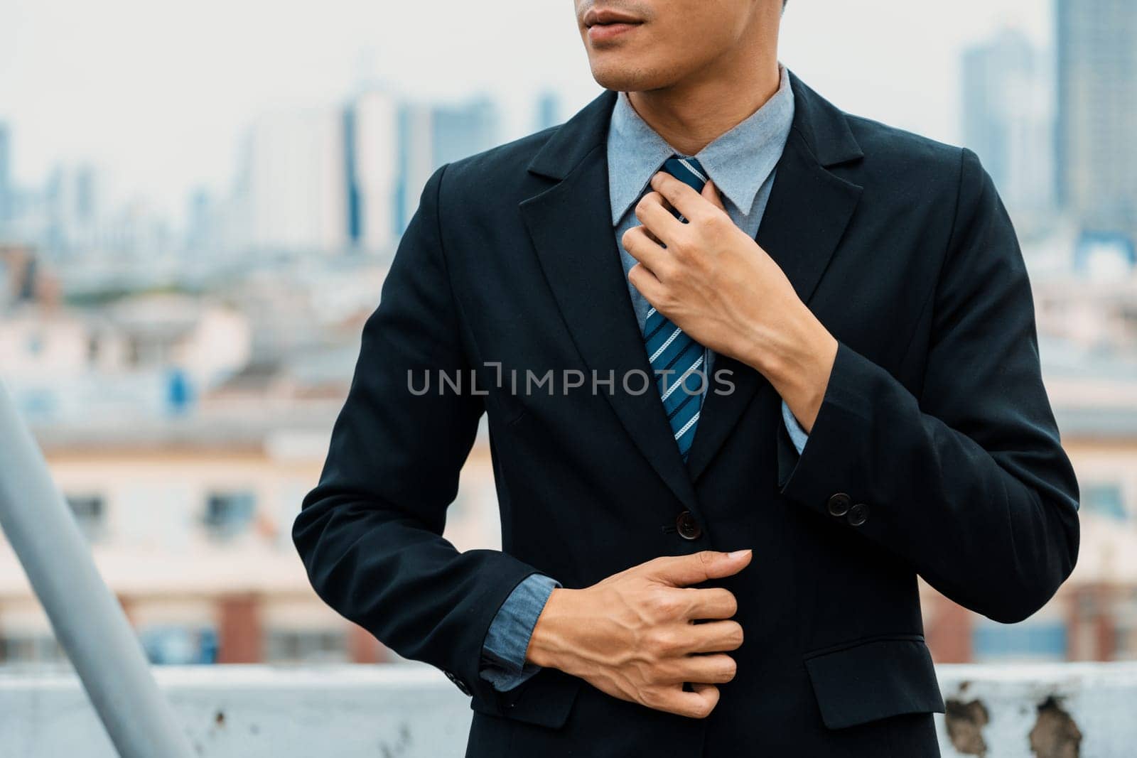 Body of businessman wearing formal business suit. Workplace fashion. uds