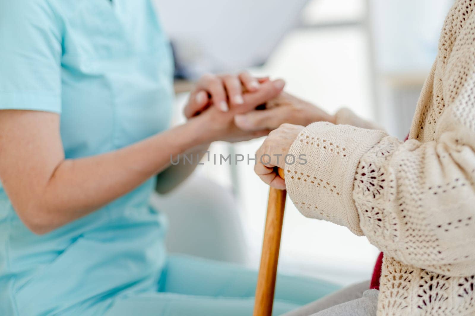 Nurse'S Hand Holding Elderly Woman'S Hand With A Cane And Nurse'S Hand Holding Pills That Elderly Woman Is Taking, Are Captured In Close-Up