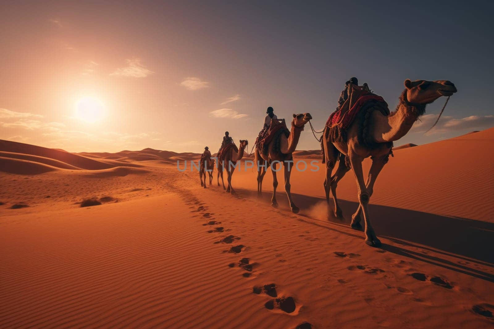 Herd of camel riders crossing the great desert.