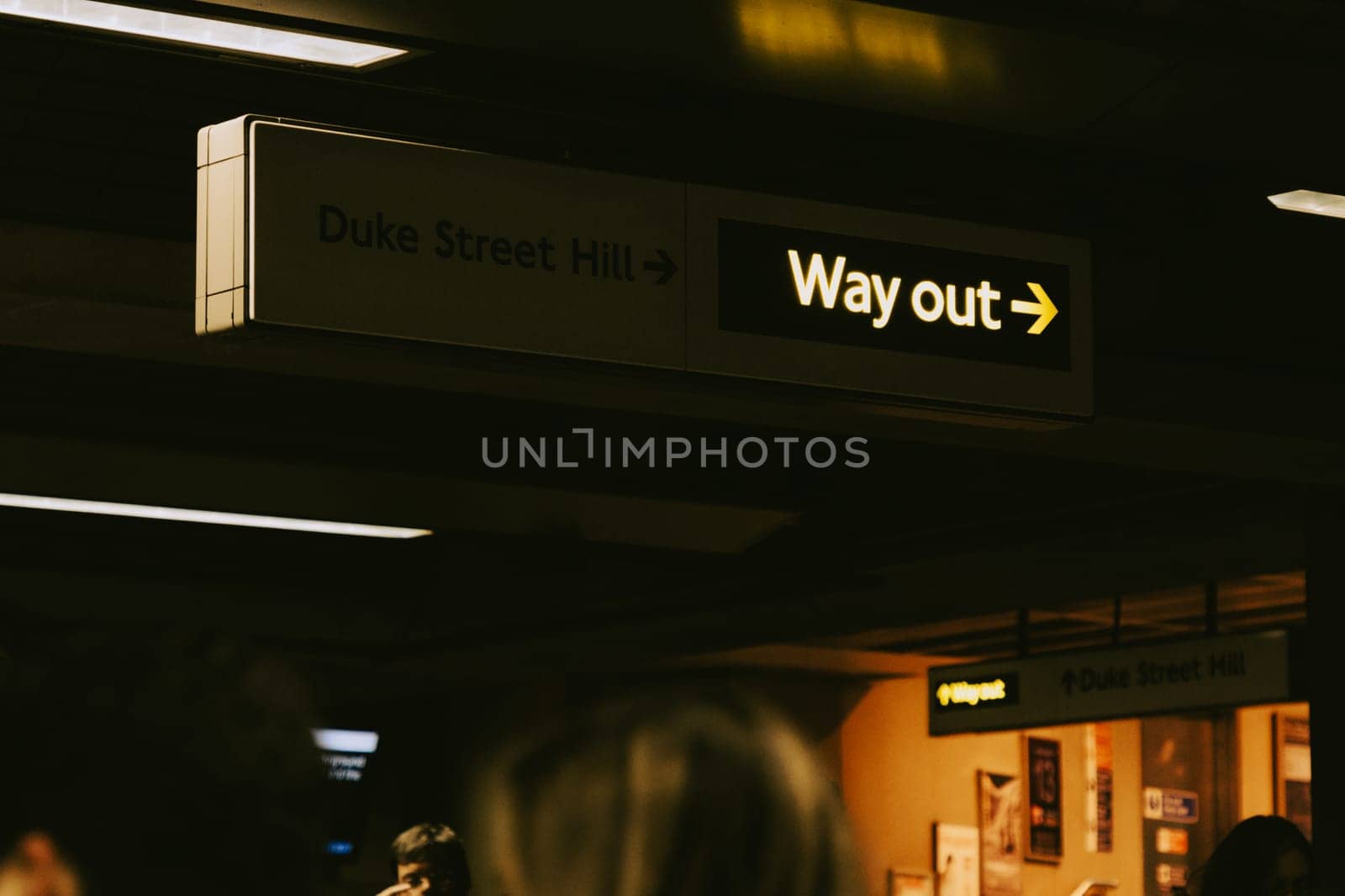 'Way out' yellow sign at the underground by Suteren