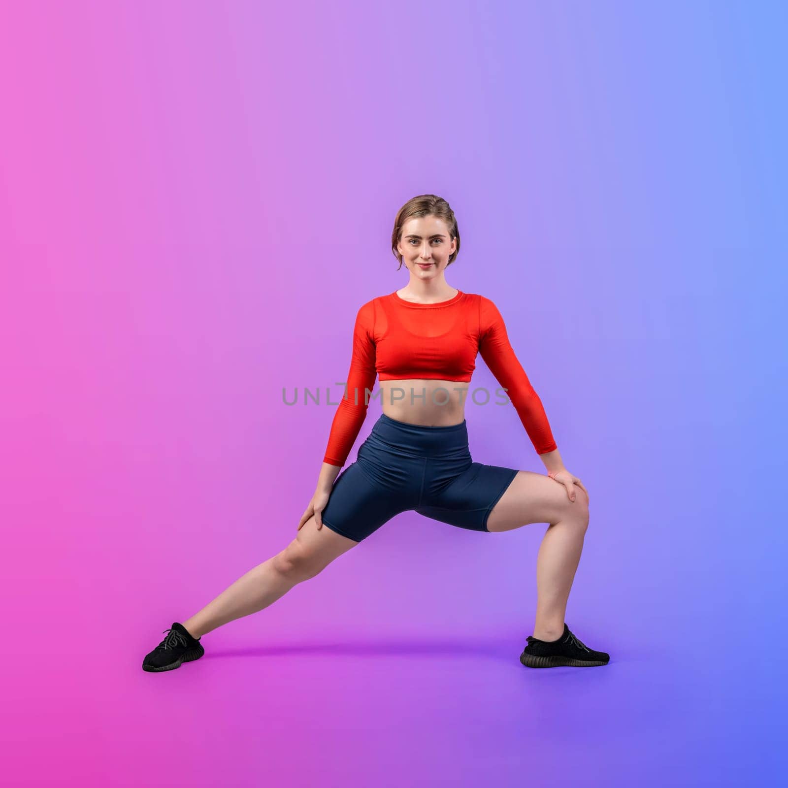 Full body length gaiety shot athletic and sporty woman doing yoga by biancoblue