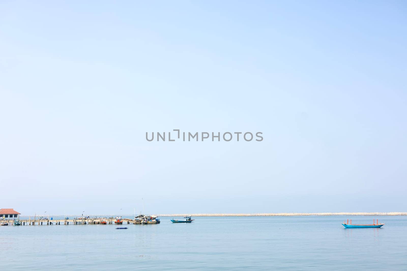 Fishing boat entering the fishers village early in the morning. 