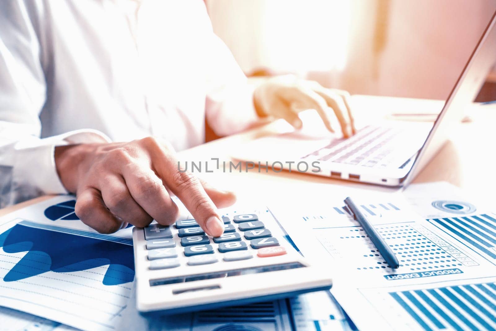 Businessman accountant or financial expert analyze business report graph and finance chart at corporate office. Concept of finance economy, banking business and stock market research. uds