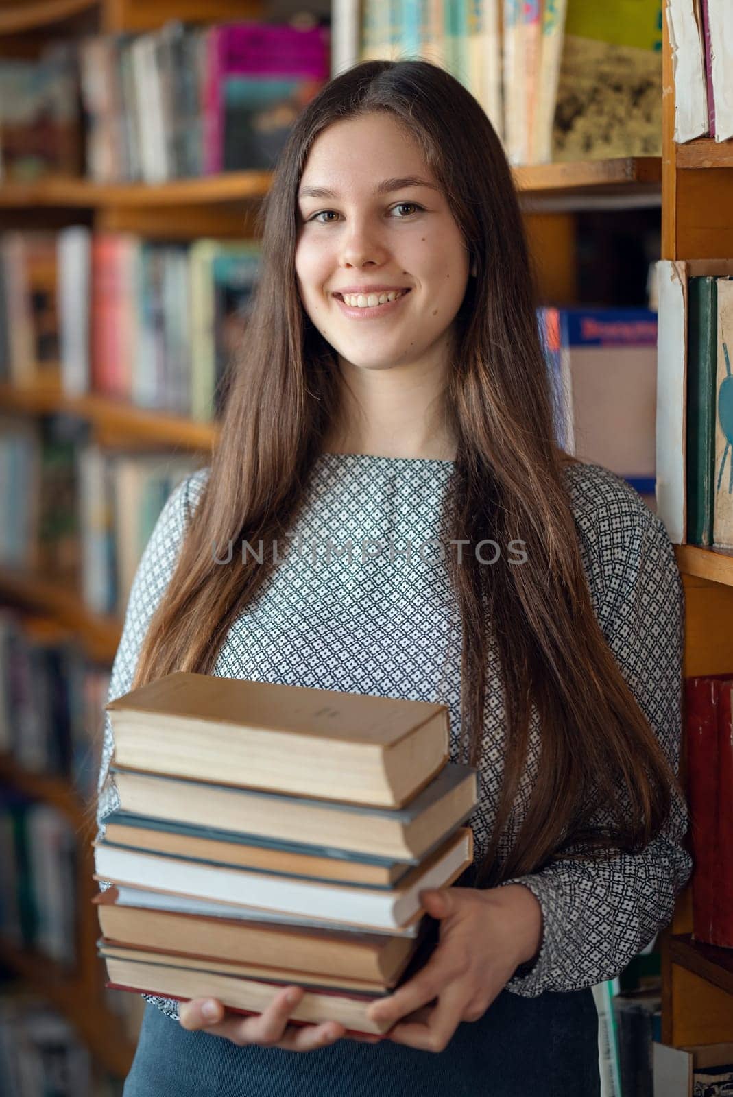 Cheerful caucasian girl studying for college exams, prepares class assignment