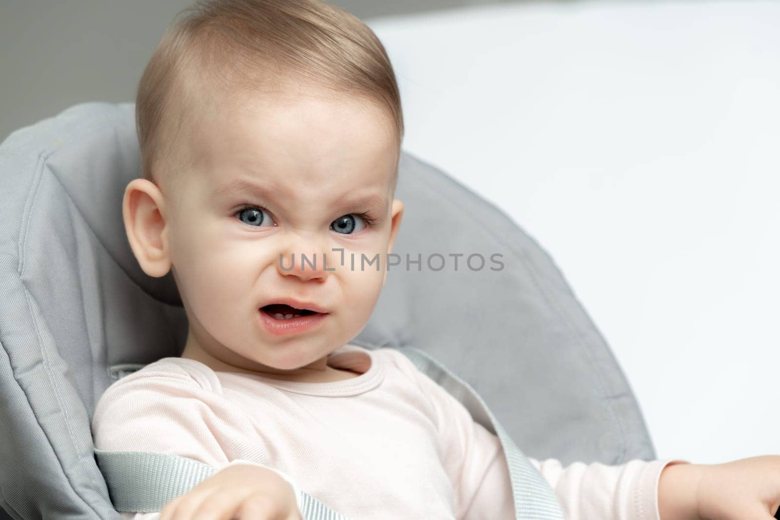 Portrait of crying toddler baby upset of being hungry and tired by Mariakray