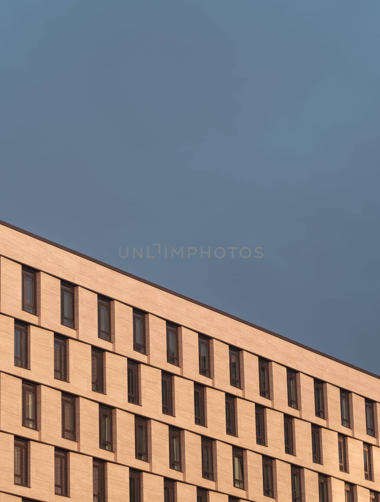 Abstract Minimalism Image Of A Modern Contemporary Hotel Against A Clear Blue Sky, With Copy Space