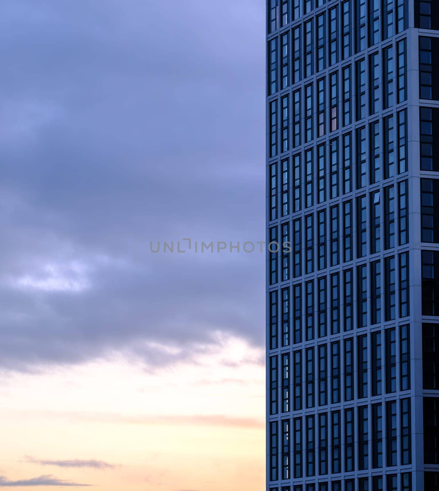 Generic Modern Downtown Apartment Building At Dusk WIth Copy Space