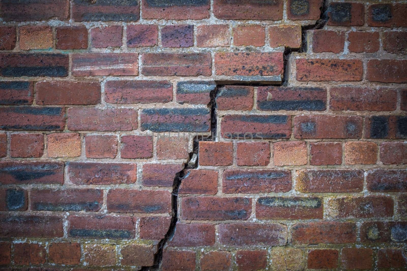 A Large Crack In An Old Red Brick Wall
