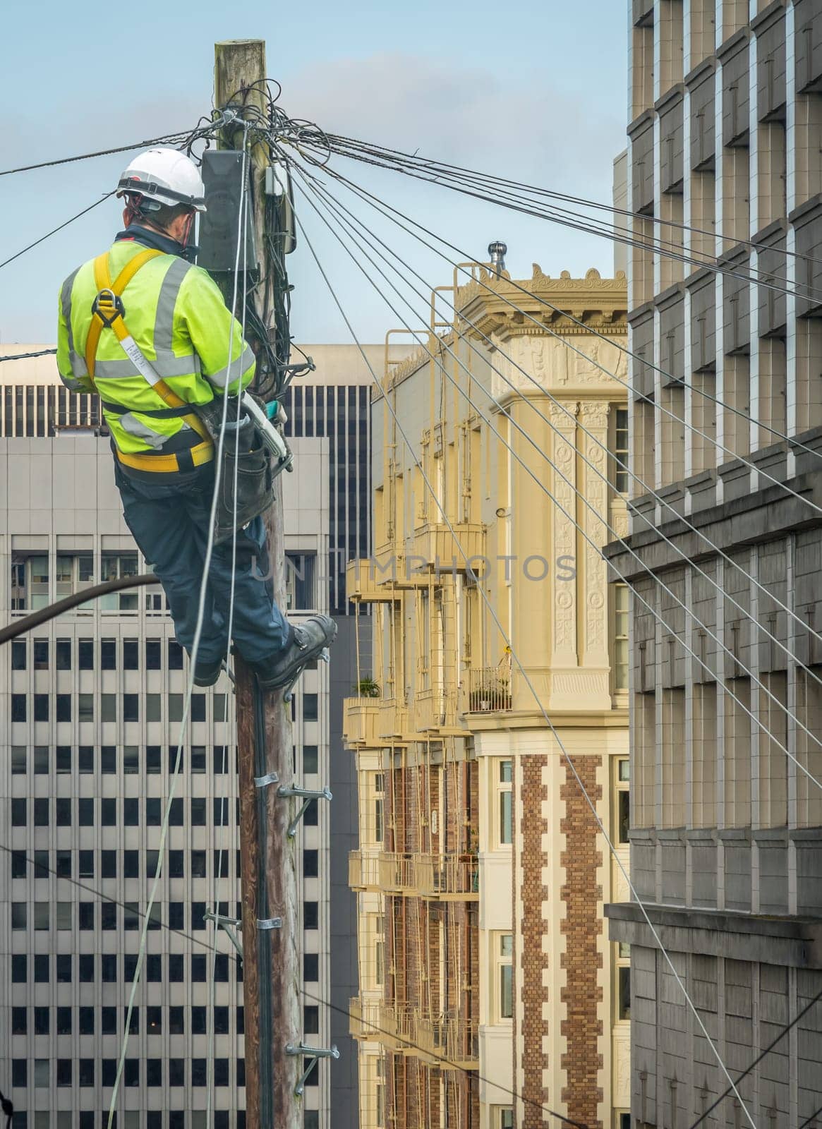 Lineman (Or Lineworker or Engineer) In A City (San Francisco) Fixing A Telephone Line