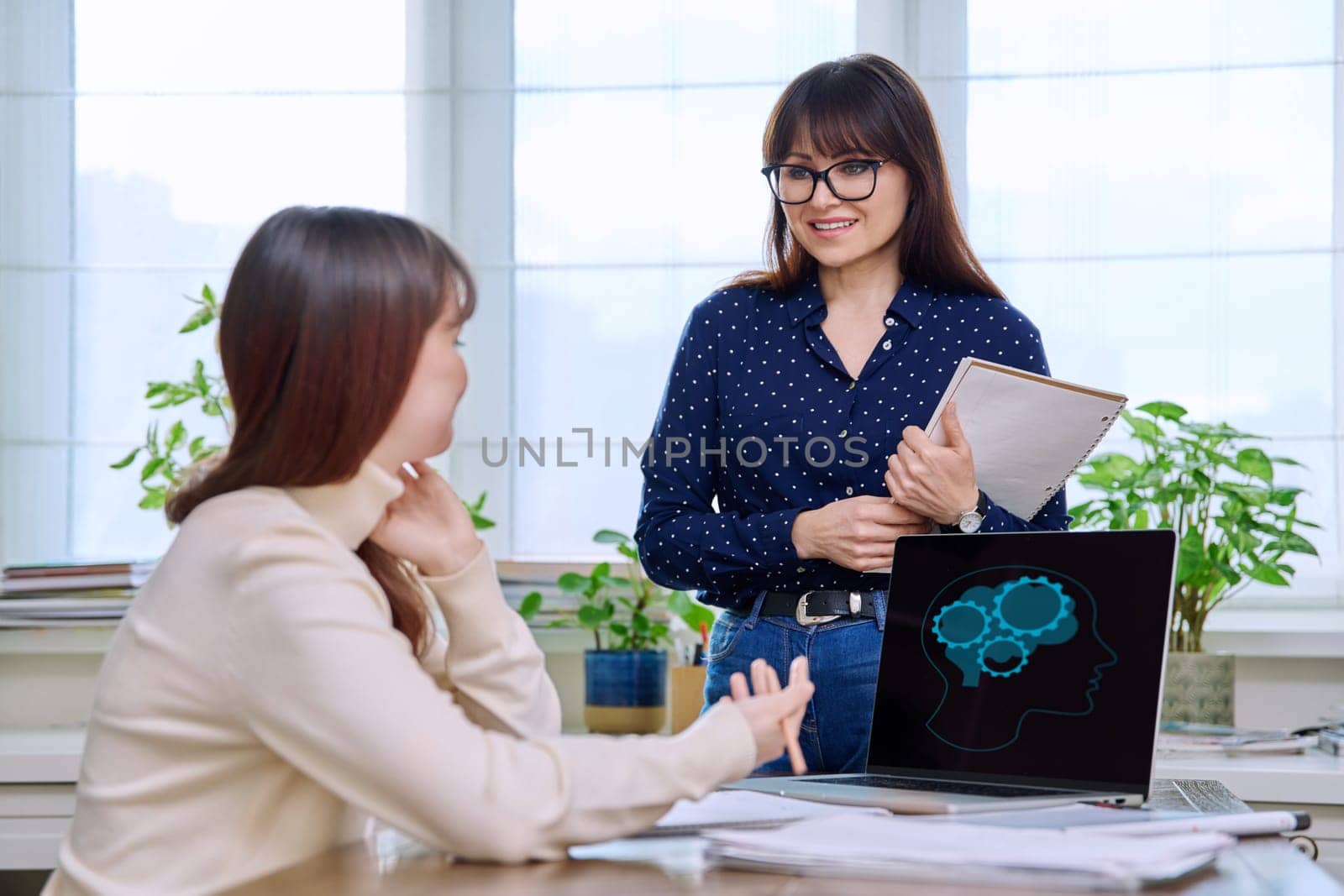 Teenage student studying at desk with computer, trainer mentor helping teaching by VH-studio