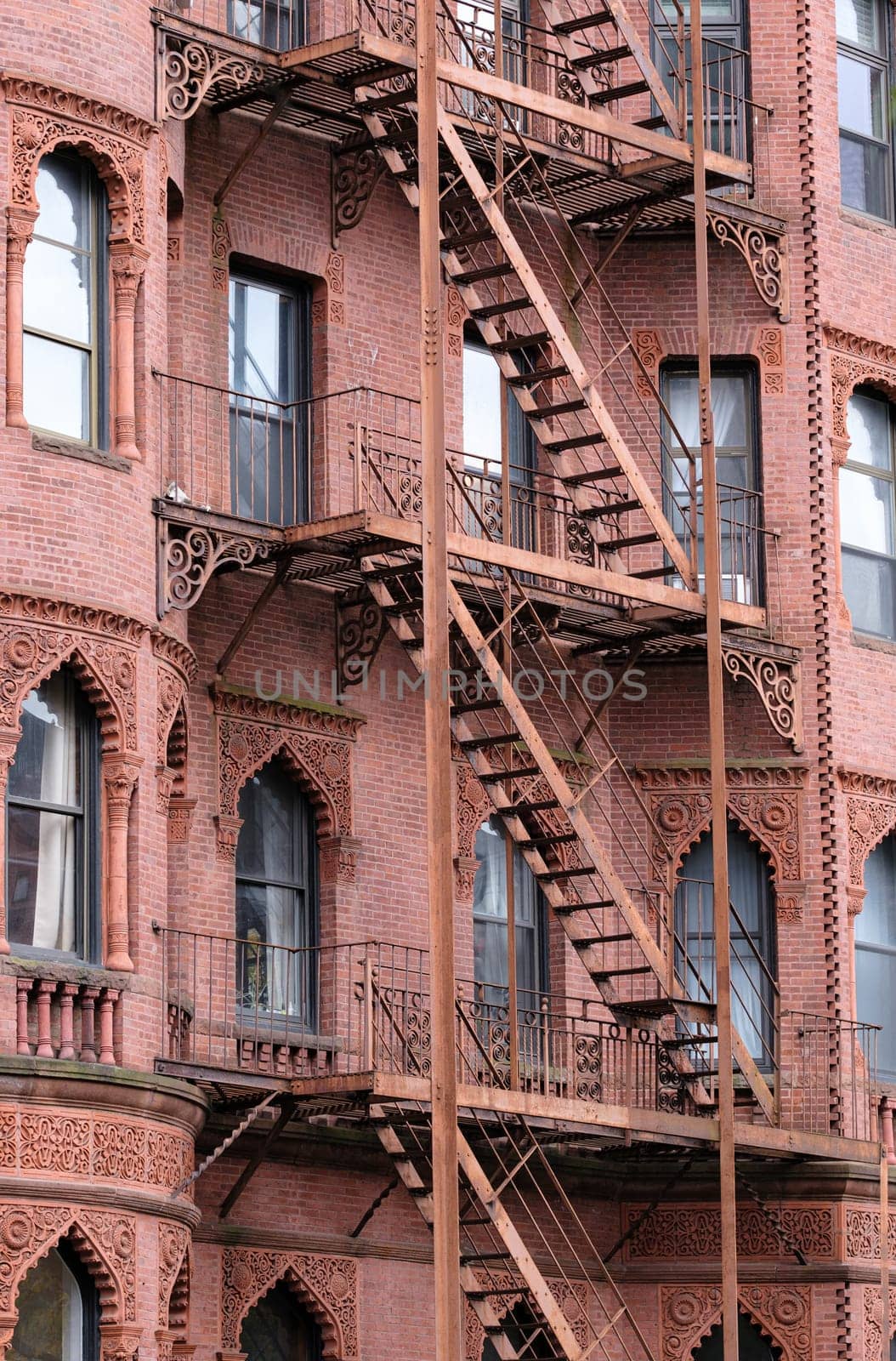 Detail Of Fire Escapes On A Traditional (Red) Brownstone Apartment Block In Boston
