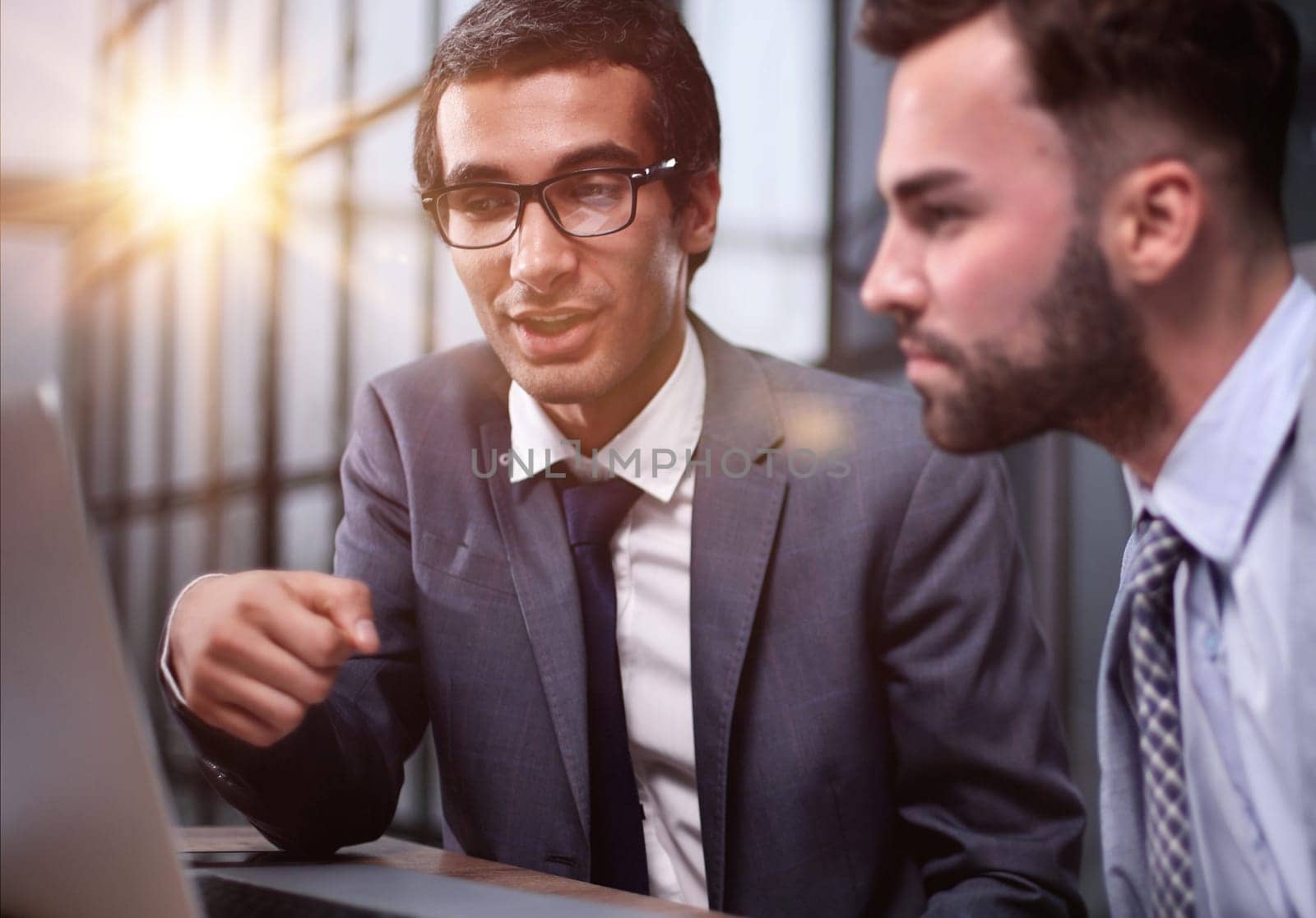 Business Having Meeting Around Table In Modern Office by Prosto