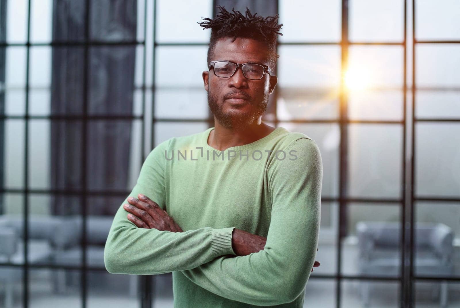 Mature cheerful african american executive businessman at workspace.