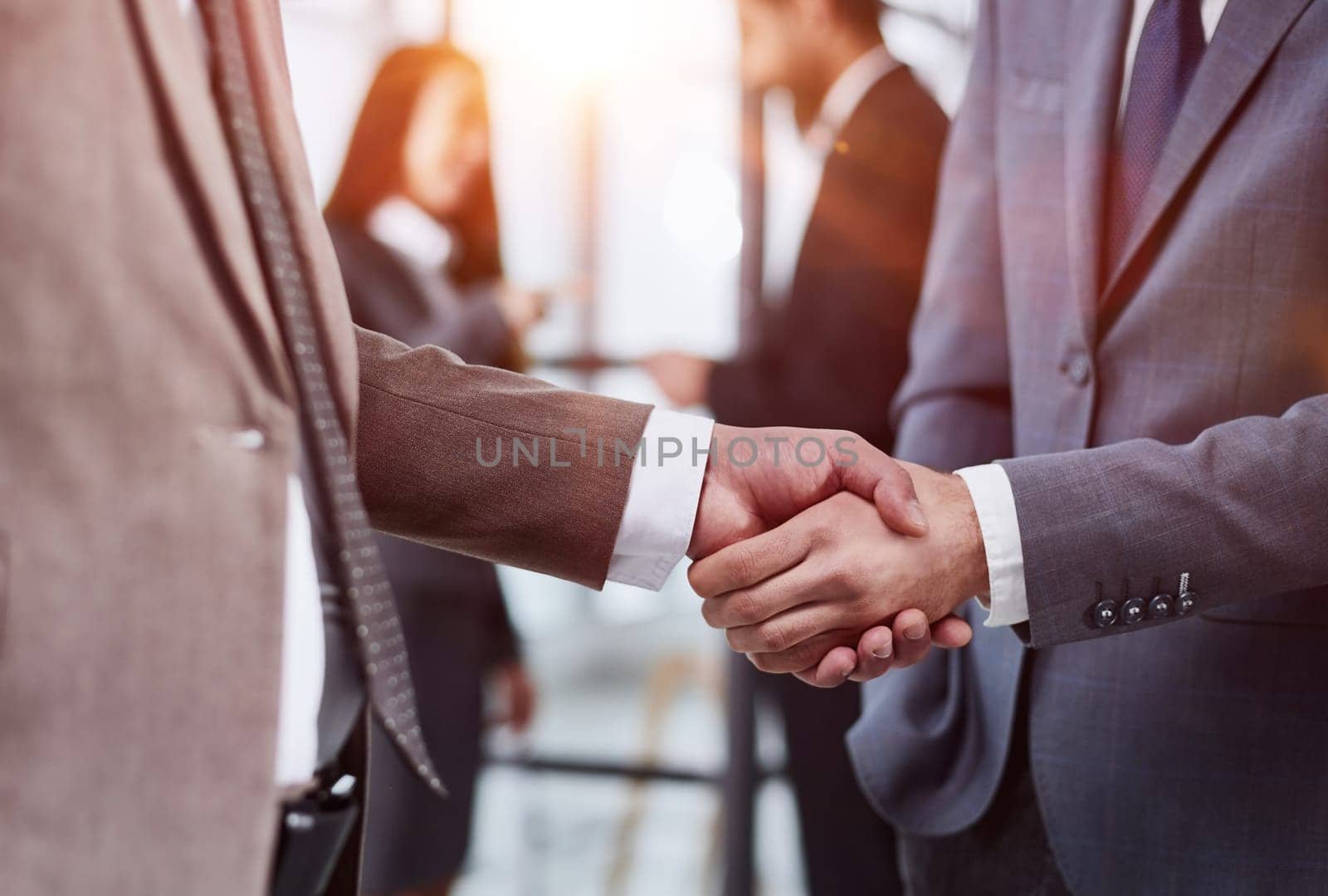 Nice to meet you. Close-up of two young businessmen shaking hands