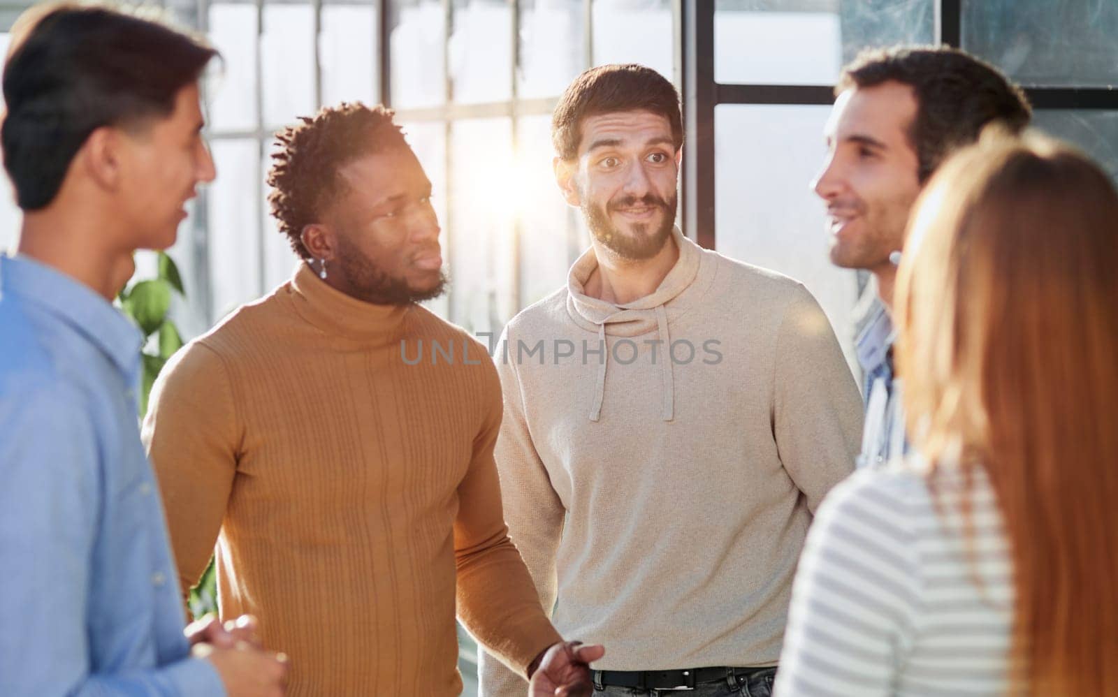 Group portrait of a professional business team having a discussion in the lobby of the office