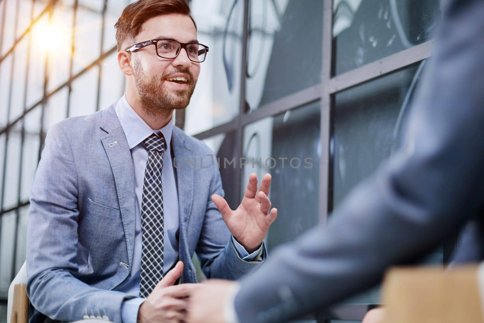 Two diverse business men analysts partners talking, working together