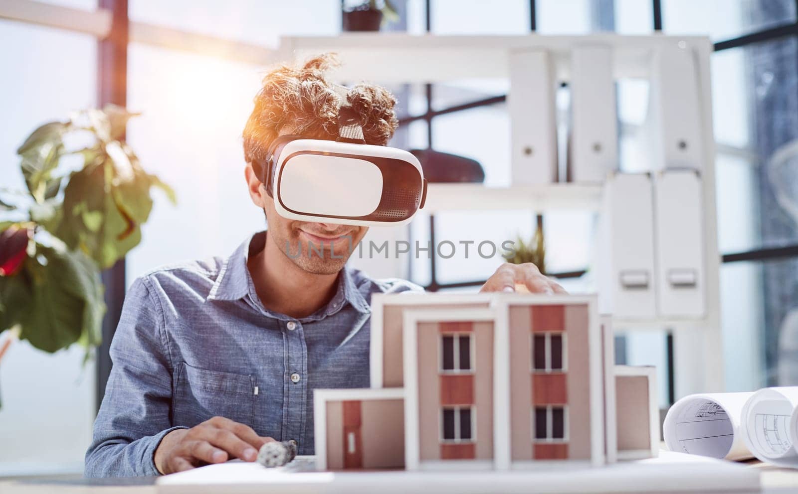 looks at the layout of the apartment in virtual reality glasses.
