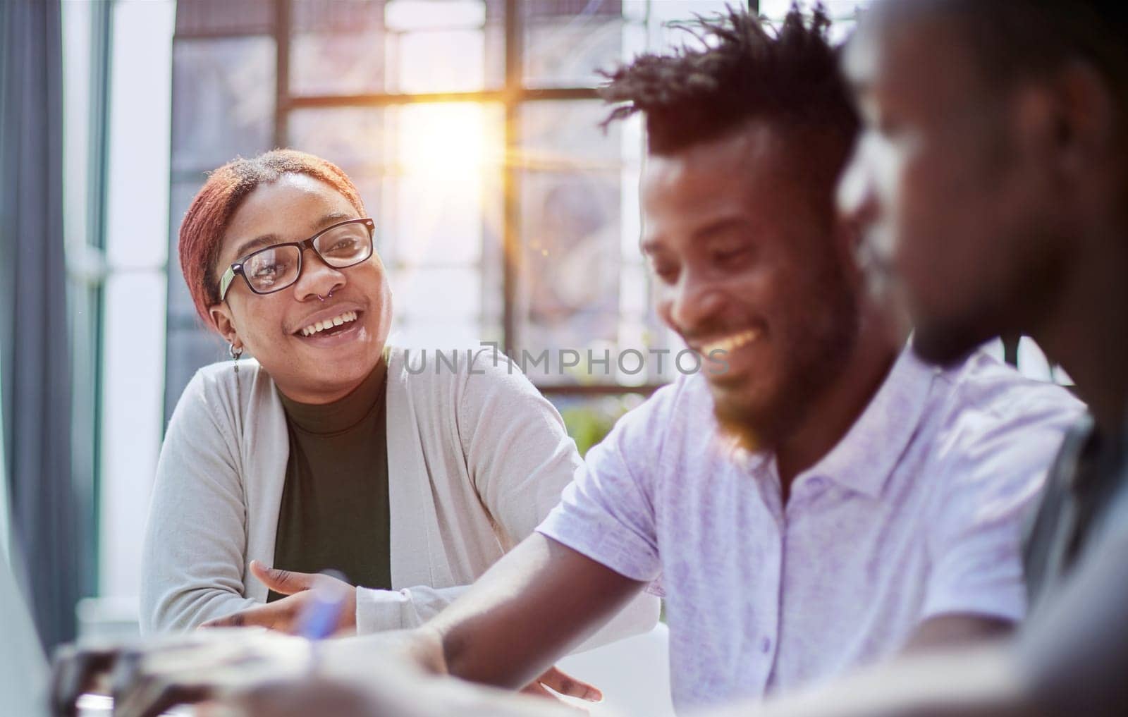 Successful african american business team talking about strategy at office by Prosto