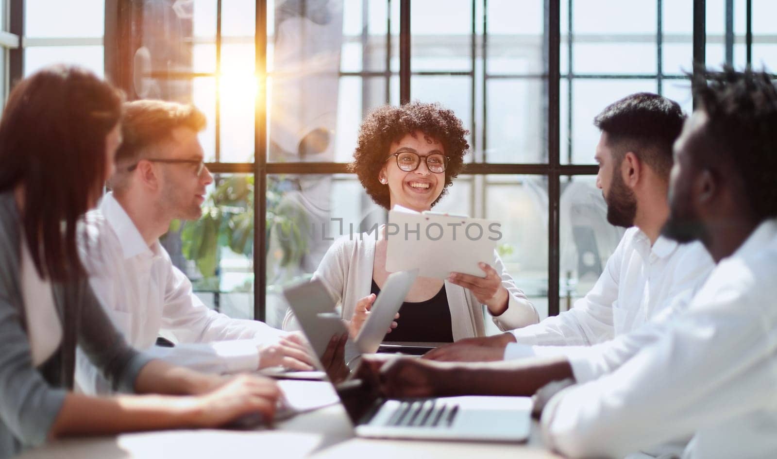 Employees working at computer together, discussing content by Prosto