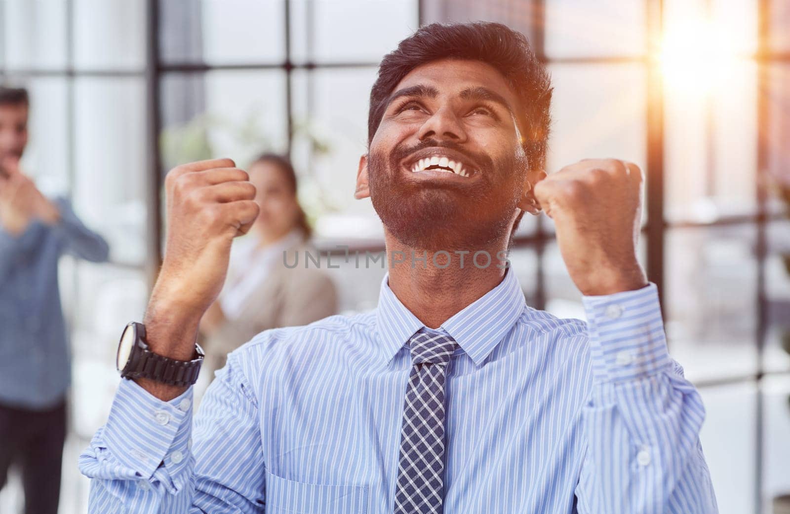 a man holding his hand up a gesture of triumph and victory. by Prosto