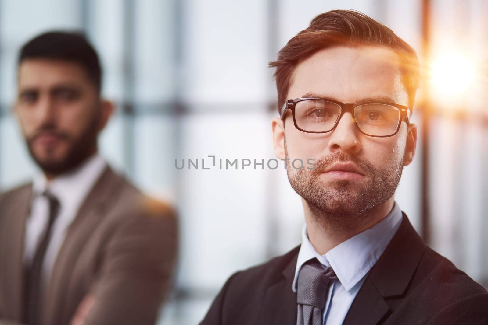Portrait of casual caucasian male worker looking at camera by Prosto