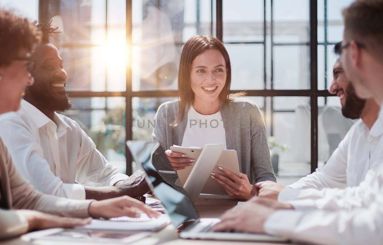 Employees working at computer together, discussing content by Prosto